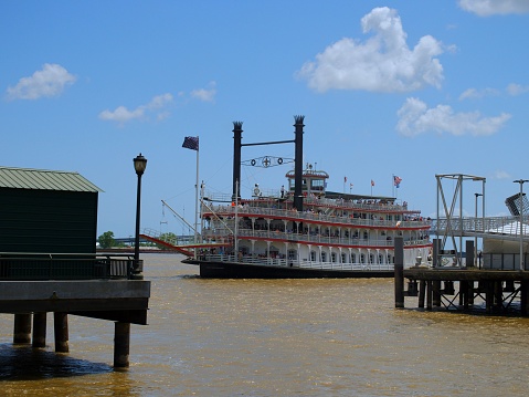 New Orleans, United States – April 22, 2022: The City of New Orleans riverboat pulling into dock at Woldenberg Park