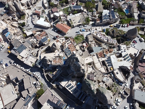 An aerial shot of the Goreme Open Air Museum under the blue sky in Turkey