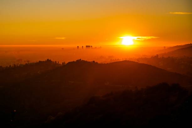 istock Orange sky of sunset over mountain range 1454561693