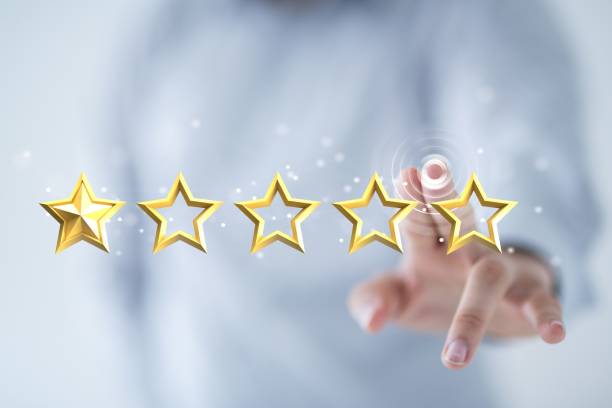 istock Hand touching to five stars - customer rating review feedback concept 1454561783