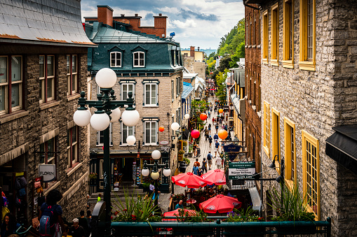 Québec City, Canada - August 22, 2022: View along a street with many stores, restaurants and pubs. Québec City is the capital of the largely French-speaking Canadian province of Québec.
