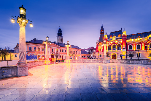 Oradea, Romania - Beautiful night scene with Union Square, famous baroque downtown, Christmas decorated. Travel destination of Transylvania.