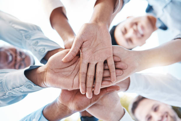 istock Team building, diversity or hands in circle for teamwork, motivation or success, mission goals or company about us. Zoom of business people hand for support, trust or global community collaboration 1454563520