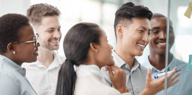 istock Business people, smile and teamwork in planning with sticky notes for strategy, brainstorming or ideas at the office. Happy creative employee team in collaboration, schedule or project plan together 1454564414
