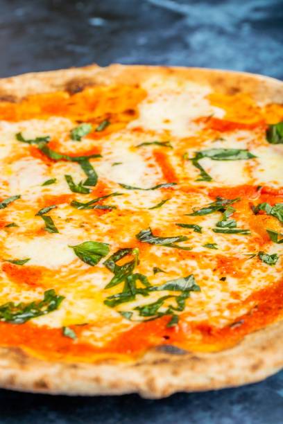 istock Serving of fresh cheese pizza 1454564884