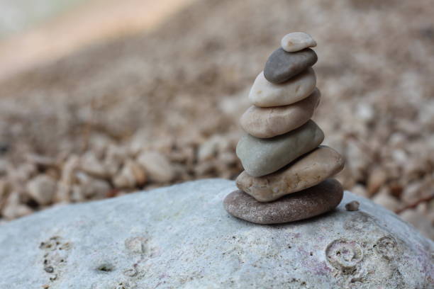 istock pyramid of small stones on the seashore 1454567364