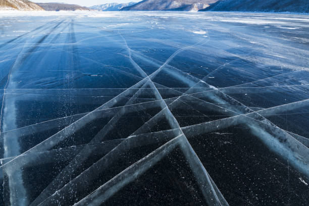 istock ice with cracks on the reservoir 1454576889