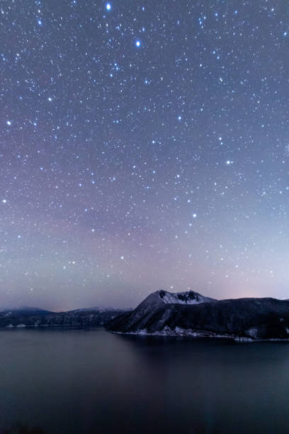 The starry sky of Lake Mashu in Hokkaido. stock photo