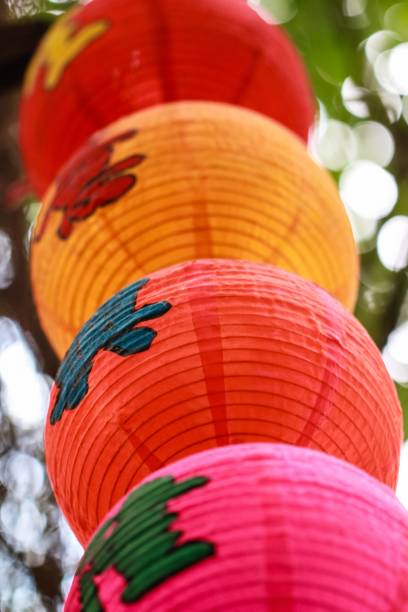 istock Low angle of traditional Chinese lamps with characters on it 1454579502