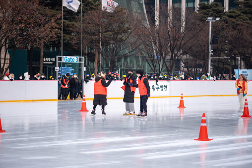 People ice skating on the temporary ice skating ring in front of the City Hall in Seoul South Korea on 6 January 2023