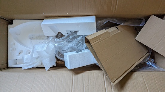 Cardboard boxes with soft filler, bubble wrap and crumpled paper. Gentle dispatch and storage of fragile items and valuable cargo