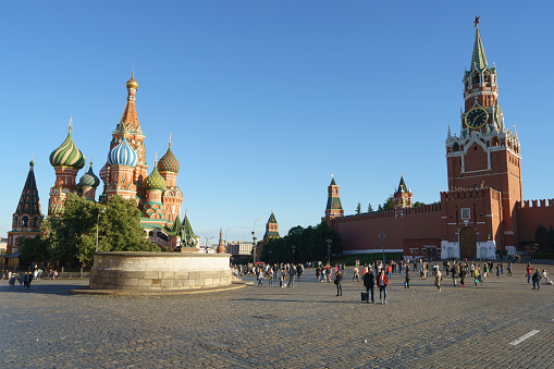 Moscow, Russia - April 7, 2019: Red Square view. The Saint Basil's Cathedral or Cathedral of Vasily the Blessed and Spasskaya or Saviour Tower. Popular touristic public location, sighseeing