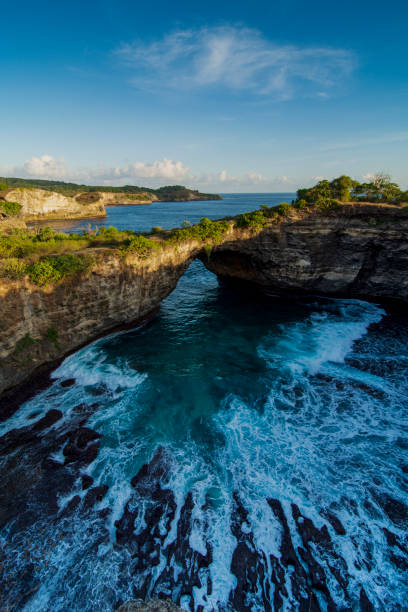 istock The Waves Through The Hole of The Hill 1454583796