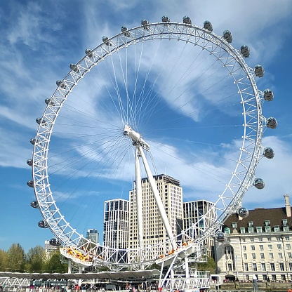 Londo, United Kingdom – April 21, 2022: A low-angle view of the London Eye from the boat in England