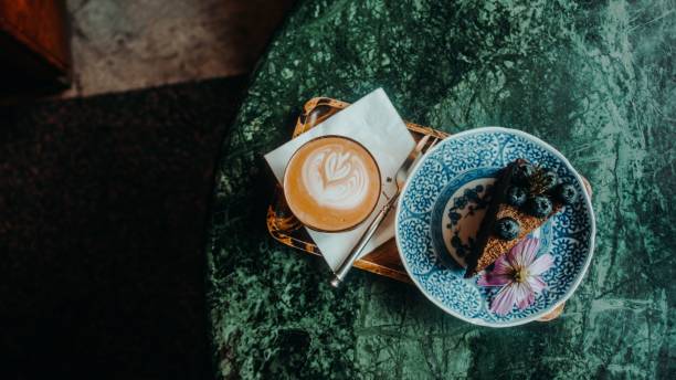 istock Top view of cup of coffee with cake 1454593003