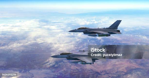 Advanced Fighter Jets Flying Together Above The Clouds Accelerates And Disappears Stock Photo - Download Image Now