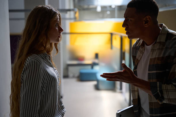 istock Young man and woman arguing in the office 1454593505