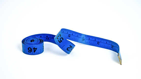Tape measures of various lengths isolated on white background.