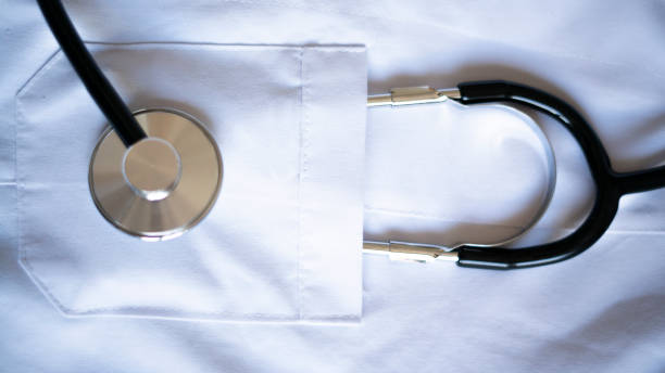 istock Stethoscope standing in pocket of white doctor's coat 1454596759