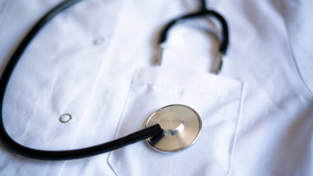 istock Stethoscope standing in pocket of white doctor's coat 1454596772