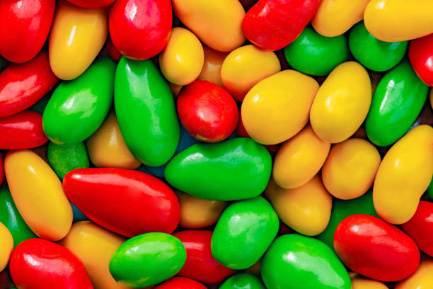 istock Candy in multi colored glaze in bulk, close-up macro, mini pieces, wallpaper background 1454597348
