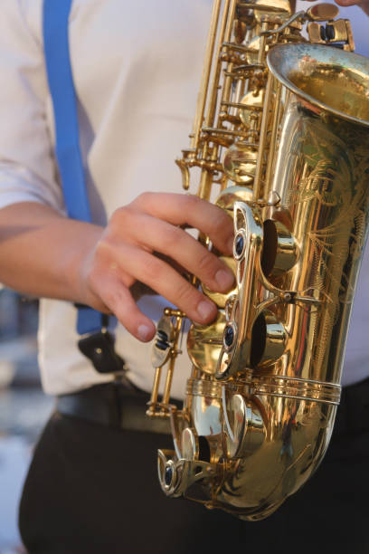 istock Jazz musician playing the saxophone 1454598434
