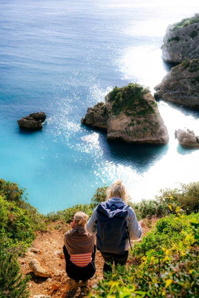 istock Sisters bonding at tropical paradise view 1454598947