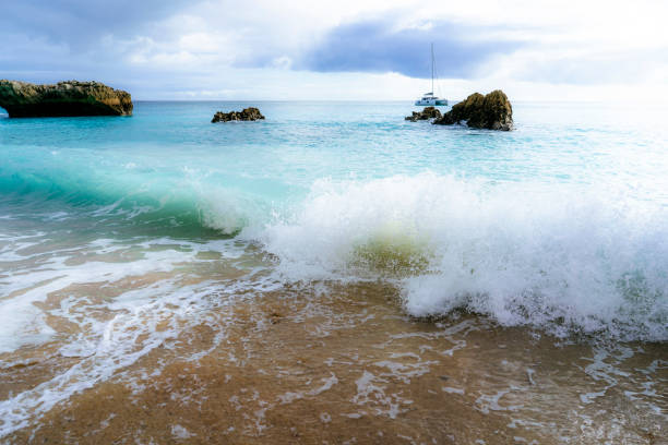 Small waves breaking at a beach close to Lisbon, Portugal