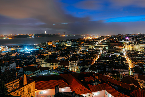 Aerial view of Lisbon cityscape illuminated at dusk. Portugal - Europe
