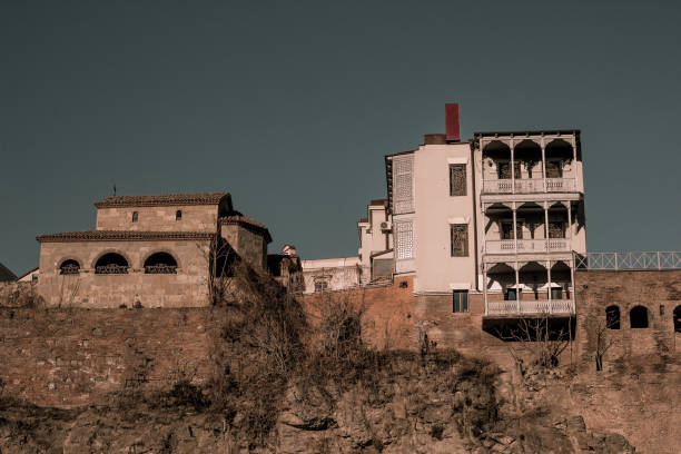 istock Old house and church 1454602818