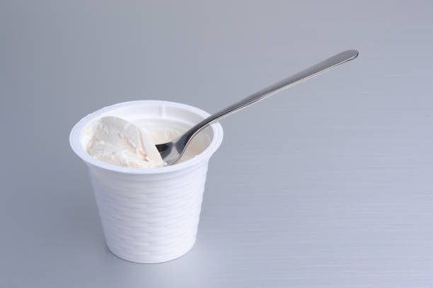 Ricotta Cheese with Spoon in Pot