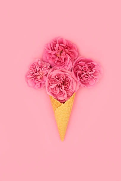istock Surreal Ice Cream Cone with Red Summer Rose Flowers 1454607947