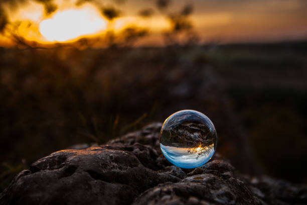 A crystal ball with a view reflected in it