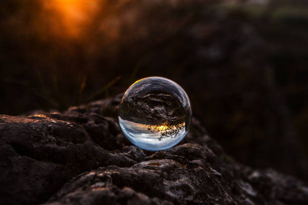 Free Stock Photo of Crystal ball reflecting a serene sunset over water ...