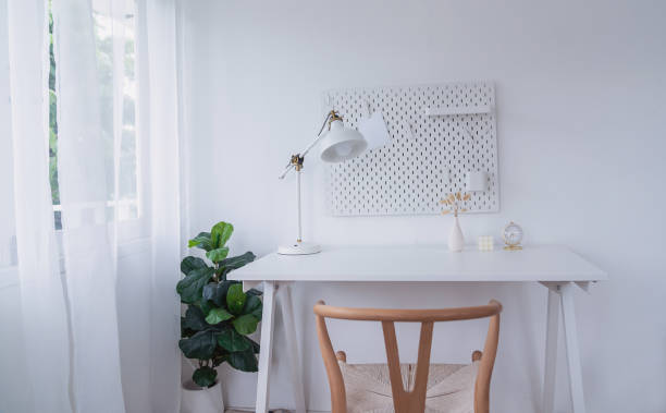 istock White desk table with copy space, white supplies. Front view minimal workspace. Supplies stationery for study learning Education or freelance sme mobile work space. 1454614213