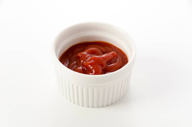 istock tomato ketchup in a small cocotte on a white background 1454618473
