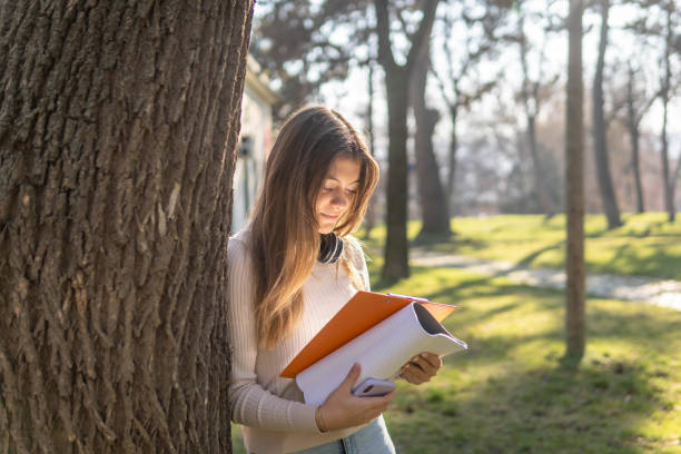 istock Student girl in the park 1454619479