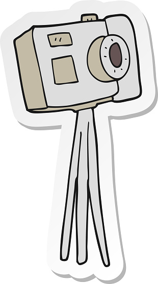 sticker of a cartoon camera on tripod