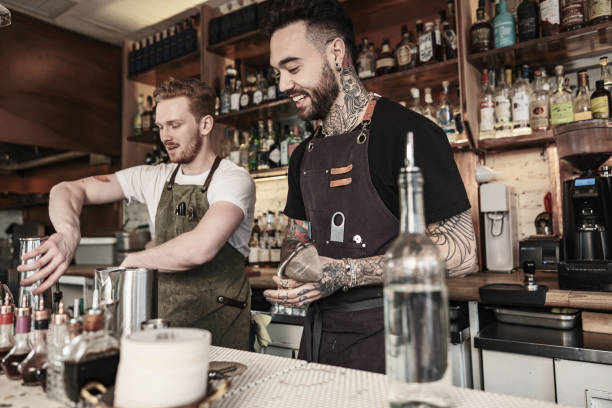istock Two Young  barmen working at the bar 1454623639