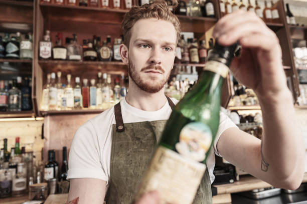 istock Young redhead barman working at the bar 1454623782