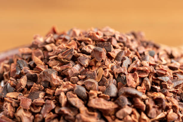 istock Bowl with cocoa nibs on the table. 1454624325