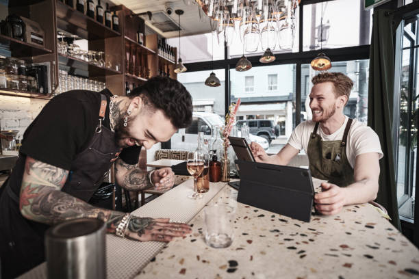istock Two Young  barmen working at the bar 1454624637