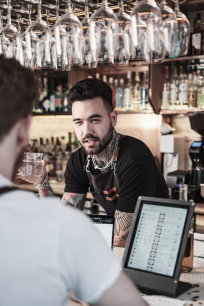 istock Two Young  barmen working at the bar 1454624738
