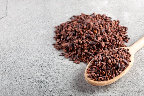 istock Bowl with cocoa nibs on the table. 1454624797