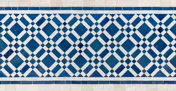 Ancient mosaic pattern in Nasrid Palaces, Alhambra de Granada. Spain