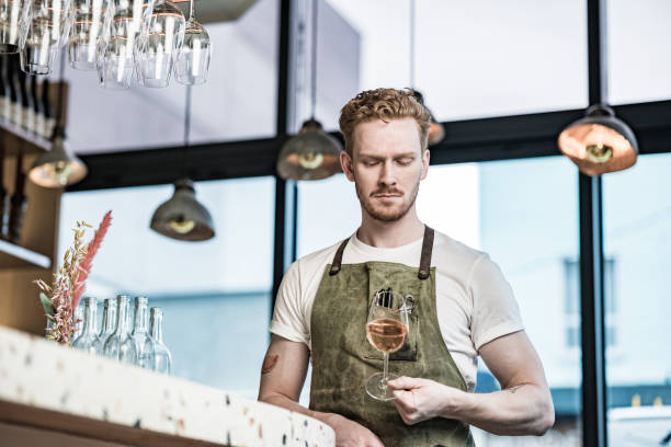 istock Young redhead barman working at the bar 1454624895