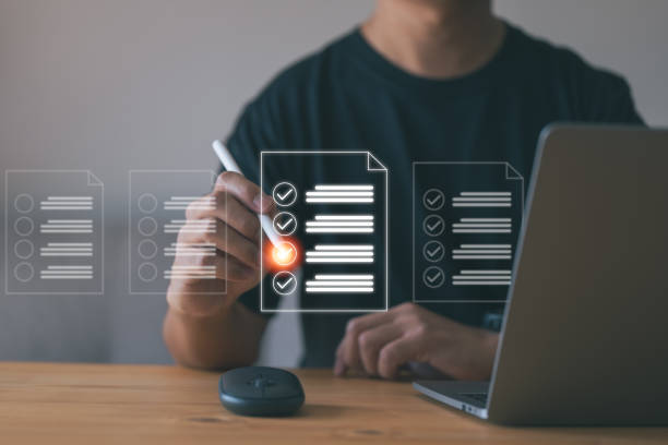 istock Concept of an online database and document management system. In order to manage files effectively, Check list by laptop computer 1454625027
