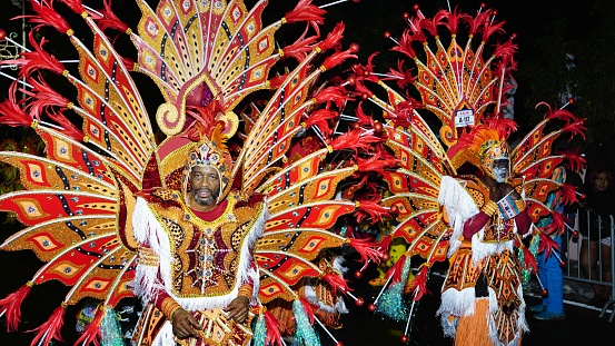 Nassau, Bahamas – December 26, 2022: The men in a traditional costume during a Junkanoo parade in the Bahamas.