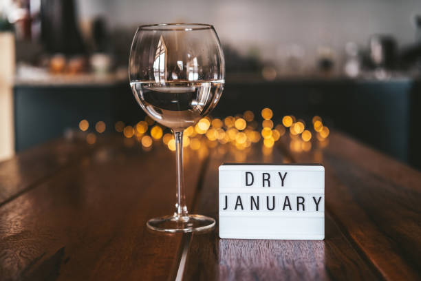Challenge dry January. Wine glass with water. Non-alcoholic month. Challenge dry January. Wine glass with water. Non-alcoholic month. Concept of healthy lifestyle. In new year without alcohol. 31 days of abstinence from alcohol dry stock pictures, royalty-free photos & images