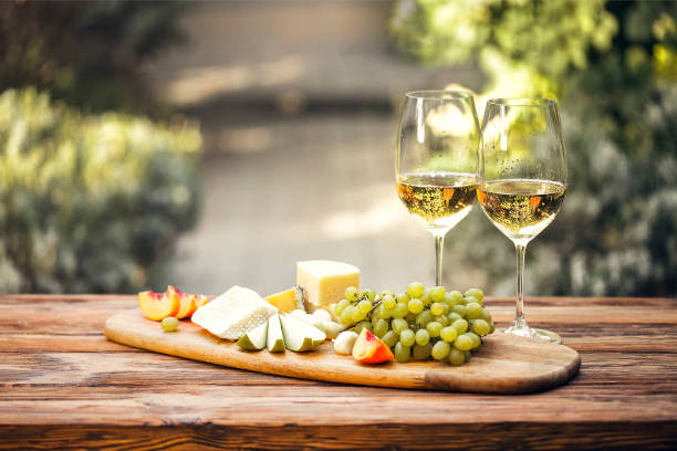 istock Table with wine and food in summer garden 1454626898